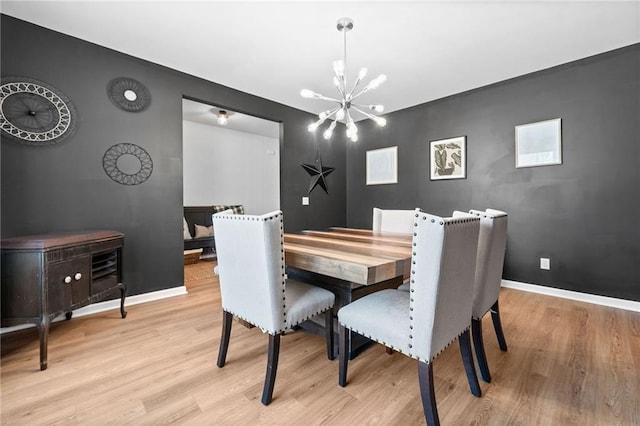 232 Northridge Dr, Dallas, GA 30132 - dining area with a chandelier, light wood finished floors, and baseboards