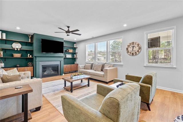 232 Northridge Dr, Dallas, GA 30132 - living area with ceiling fan, a glass covered fireplace, light wood finished floors, recessed lighting, and baseboards