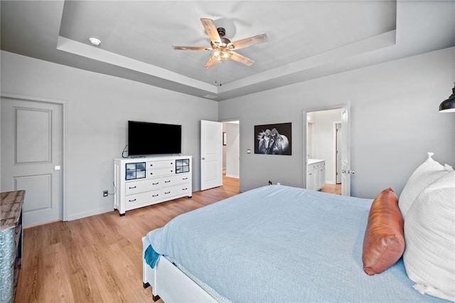 232 Northridge Dr, Dallas, GA 30132 - bedroom with a tray ceiling, light wood-style flooring, baseboards, and a ceiling fan