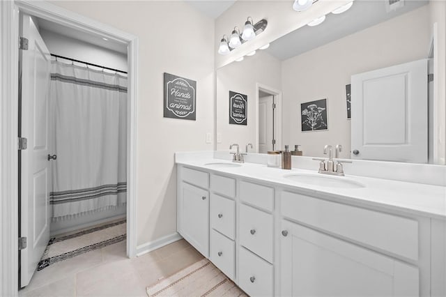 232 Northridge Dr, Dallas, GA 30132 - bathroom with double vanity, tile patterned floors, and baseboards