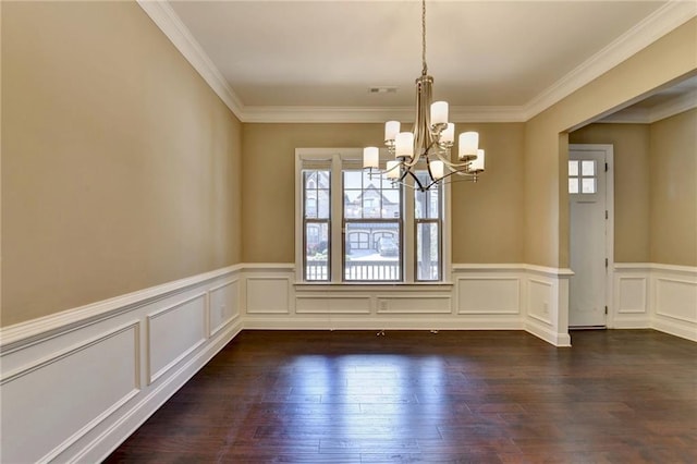 12095 Cameron Dr, Duluth, GA 30097 - unfurnished dining area featuring a chandelier, dark wood-type flooring, crown molding, a wainscoted wall, and a decorative wall