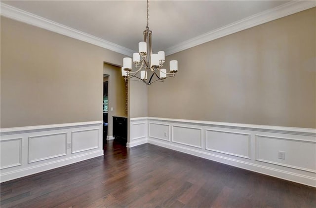 12095 Cameron Dr, Duluth, GA 30097 - spare room with a chandelier, crown molding, dark wood-style floors, wainscoting, and a decorative wall