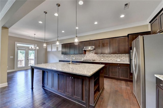 12095 Cameron Dr, Duluth, GA 30097 - kitchen featuring appliances with stainless steel finishes, a sink, under cabinet range hood, tasteful backsplash, and recessed lighting