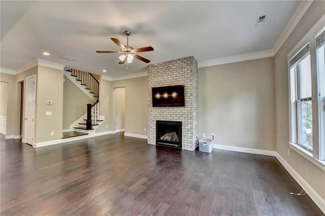 12095 Cameron Dr, Duluth, GA 30097 - unfurnished living room featuring a ceiling fan, plenty of natural light, a brick fireplace, dark wood finished floors, and recessed lighting