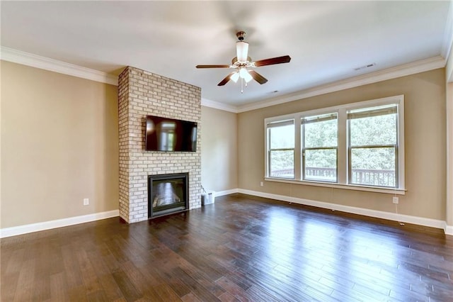 12095 Cameron Dr, Duluth, GA 30097 - unfurnished living room with a ceiling fan, dark wood-type flooring, a fireplace, baseboards, and crown molding