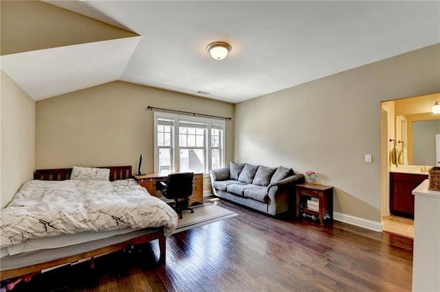 12095 Cameron Dr, Duluth, GA 30097 - bedroom featuring wood finished floors, vaulted ceiling, and a desk