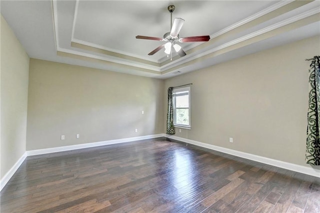 12095 Cameron Dr, Duluth, GA 30097 - spare room with a raised ceiling, crown molding, a ceiling fan, dark wood-style floors, and baseboards