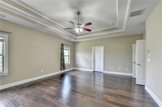 12095 Cameron Dr, Duluth, GA 30097 - spare room featuring a raised ceiling, ceiling fan, crown molding, dark wood finished floors, and baseboards