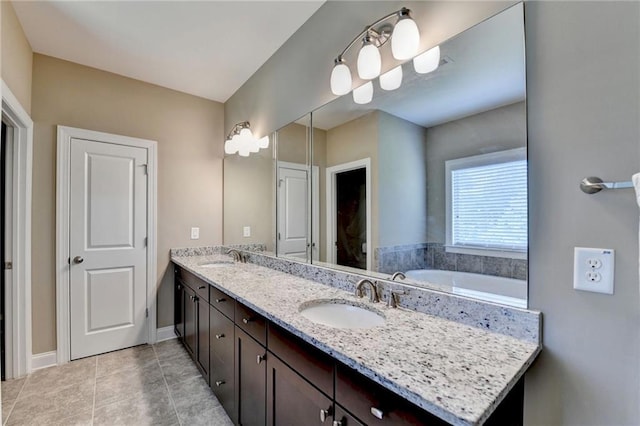 12095 Cameron Dr, Duluth, GA 30097 - bathroom featuring double vanity, tile patterned flooring, and baseboards