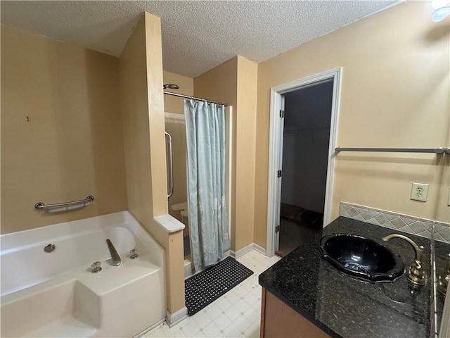 134 Summer Lake Dr, Dallas, GA 30157 - bathroom featuring a shower with curtain, a garden tub, vanity, a spacious closet, and a textured ceiling