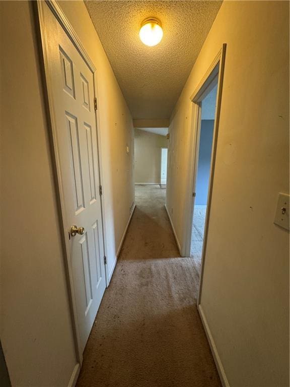 134 Summer Lake Dr, Dallas, GA 30157 - corridor with a textured ceiling, carpet floors, and baseboards
