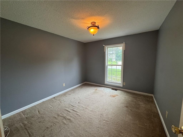 134 Summer Lake Dr, Dallas, GA 30157 - carpeted spare room with a textured ceiling and baseboards