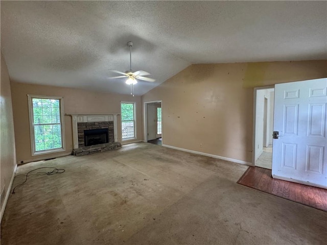 134 Summer Lake Dr, Dallas, GA 30157 - unfurnished living room featuring carpet flooring, a ceiling fan, baseboards, lofted ceiling, and a textured ceiling