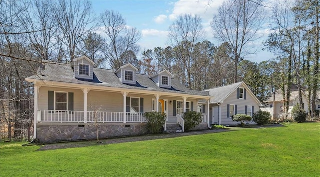 cape cod home with a porch and a front lawn