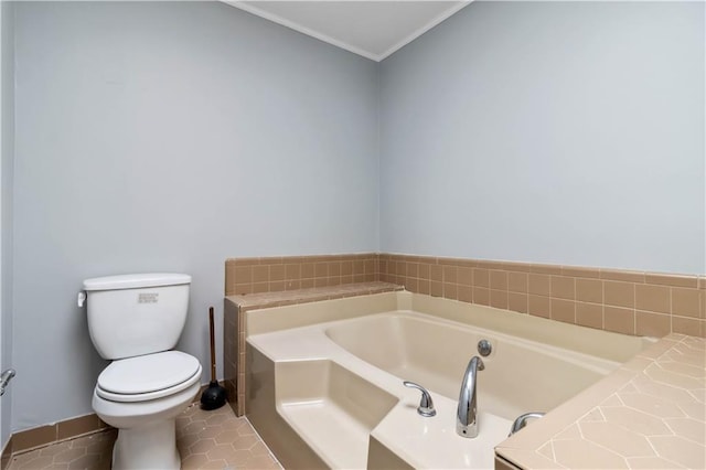 bathroom with a garden tub, baseboards, ornamental molding, tile patterned floors, and toilet