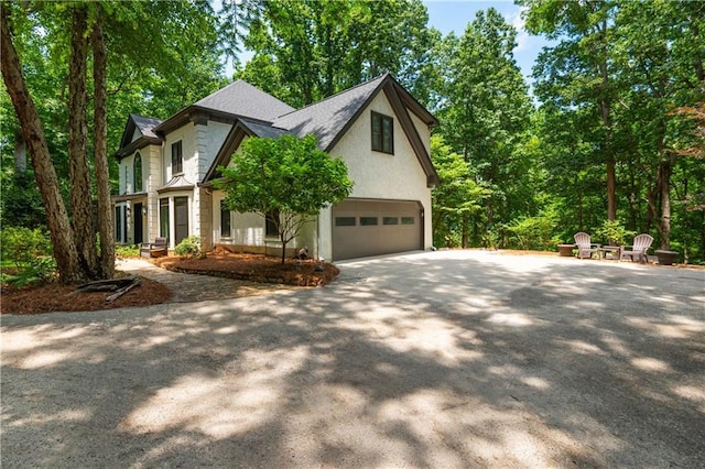 210 Hunters Vw, Roswell, GA 30075 - view of front of property with concrete driveway, an attached garage, stucco siding, and a shingled roof