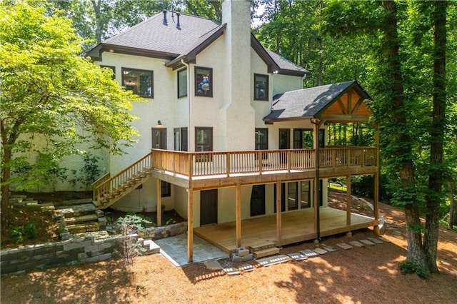 210 Hunters Vw, Roswell, GA 30075 - back of property with a wooden deck, stucco siding, a chimney, a patio, and a shingled roof