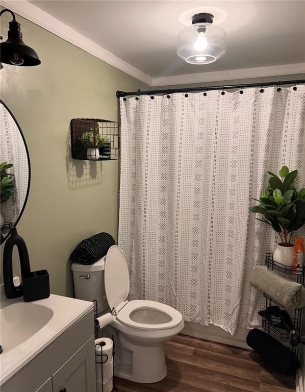 40 Legend Creek Chase, Douglasville, GA 30134 - bathroom featuring vanity, toilet, wood finished floors, ornamental molding, and curtained shower
