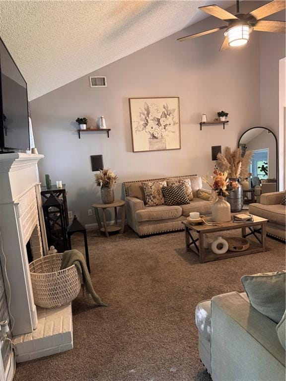 40 Legend Creek Chase, Douglasville, GA 30134 - carpeted living area with vaulted ceiling, a textured ceiling, ceiling fan, and a brick fireplace