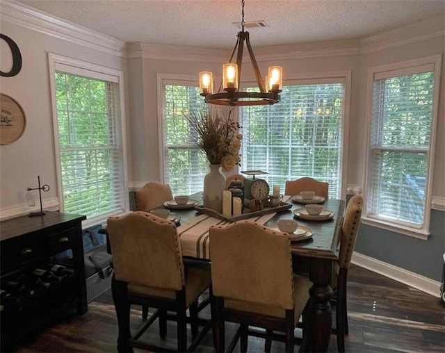 40 Legend Creek Chase, Douglasville, GA 30134 - dining area with a chandelier, dark wood-type flooring, a textured ceiling, and ornamental molding