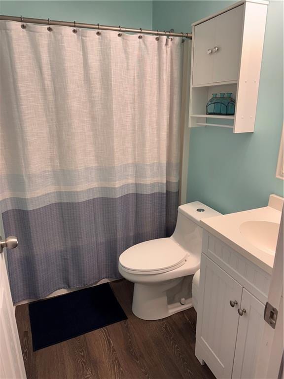 40 Legend Creek Chase, Douglasville, GA 30134 - bathroom with wood finished floors, toilet, vanity, and curtained shower