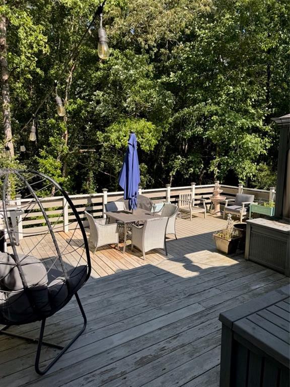 40 Legend Creek Chase, Douglasville, GA 30134 - deck featuring outdoor dining space and view of scattered trees