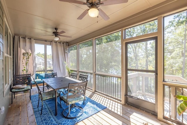 7143 Lake Edge Dr, Flowery Branch, GA 30542 - sunroom with ceiling fan and outdoor dining area