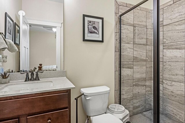 7143 Lake Edge Dr, Flowery Branch, GA 30542 - full bath featuring toilet, a shower stall, and vanity