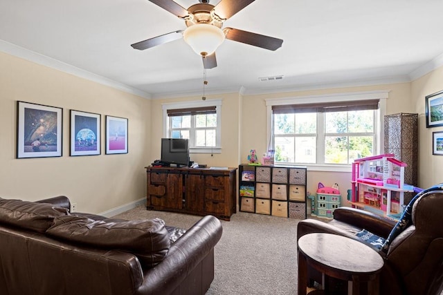 7143 Lake Edge Dr, Flowery Branch, GA 30542 - living area featuring ornamental molding, a ceiling fan, visible vents, and carpet floors