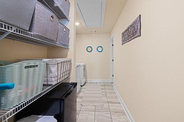 7143 Lake Edge Dr, Flowery Branch, GA 30542 - laundry room featuring washing machine and dryer, laundry area, baseboards, attic access, and marble finish floor