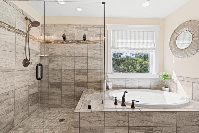 7143 Lake Edge Dr, Flowery Branch, GA 30542 - full bathroom with a garden tub, a stall shower, and recessed lighting