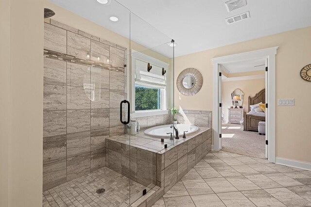 7143 Lake Edge Dr, Flowery Branch, GA 30542 - full bath featuring a stall shower, visible vents, a bath, and ensuite bath