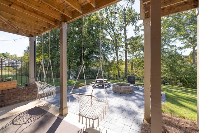 7143 Lake Edge Dr, Flowery Branch, GA 30542 - view of patio / terrace with a fire pit and fence
