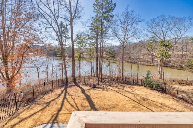 7143 Lake Edge Dr, Flowery Branch, GA 30542 - view of yard featuring fence and a water view