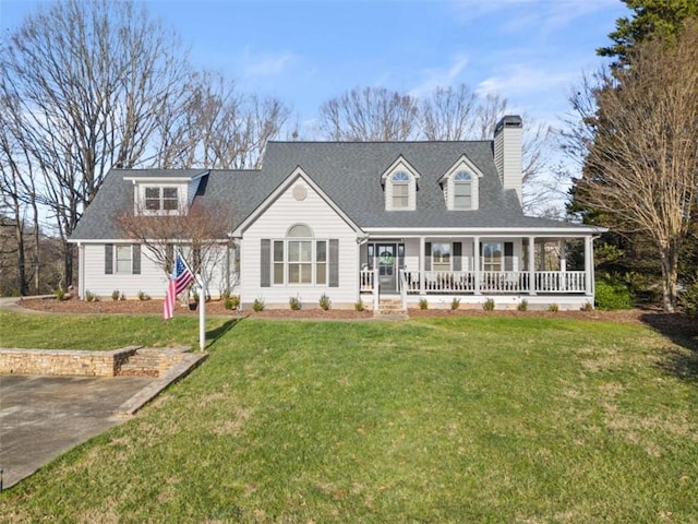 new england style home featuring a front lawn and a porch