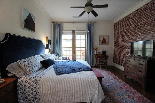 bedroom featuring dark hardwood / wood-style flooring, ornamental molding, ceiling fan, and brick wall