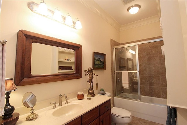 full bathroom featuring tile patterned flooring, bath / shower combo with glass door, vanity, ornamental molding, and toilet