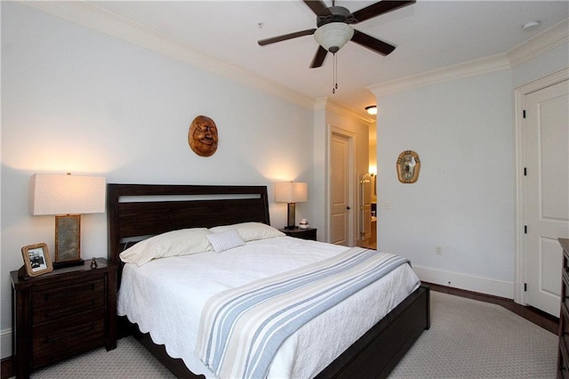 bedroom with ornamental molding and ceiling fan