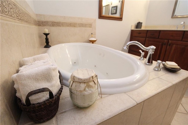 bathroom featuring vanity and a bath