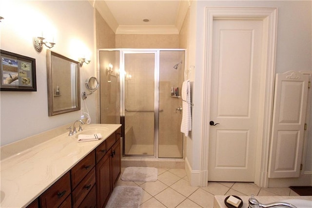 bathroom featuring ornamental molding, vanity, tile patterned floors, and a shower with shower door