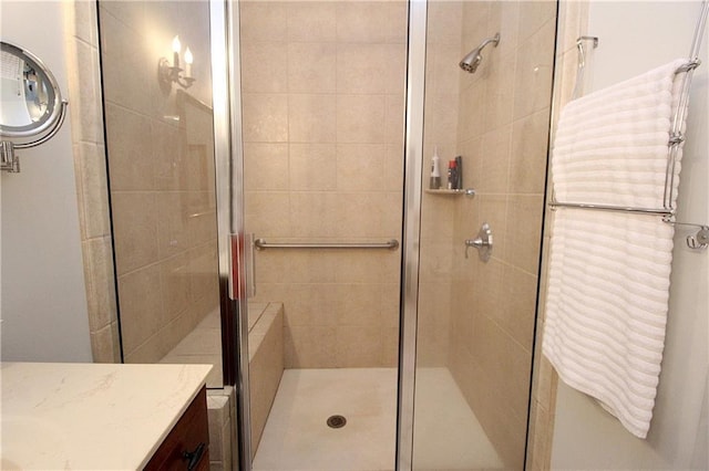 bathroom featuring an enclosed shower and vanity