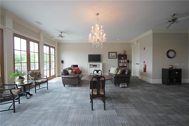 living room featuring crown molding, ceiling fan, and carpet floors