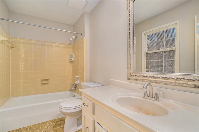 full bathroom with vanity, toilet, and tiled shower / bath