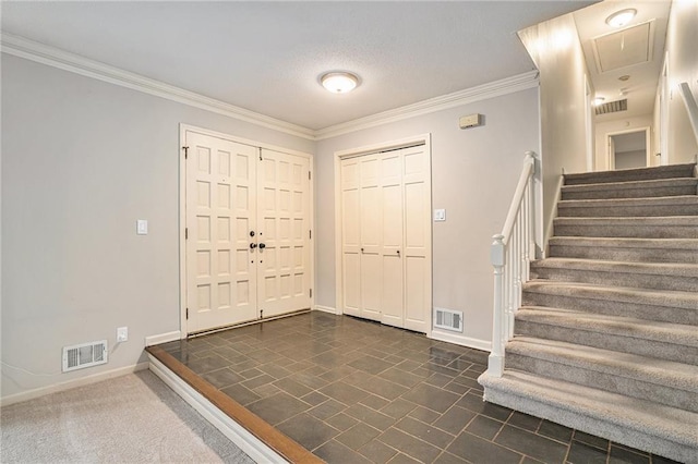 entryway with crown molding