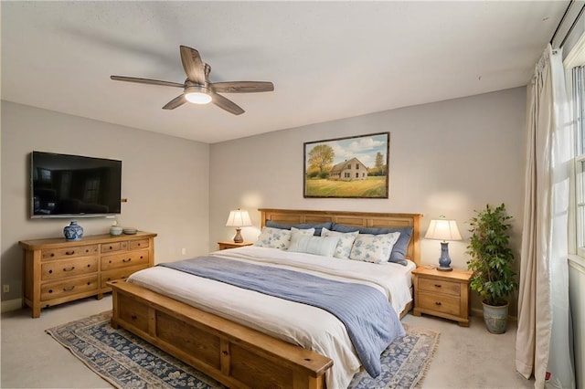 bedroom with light colored carpet and ceiling fan