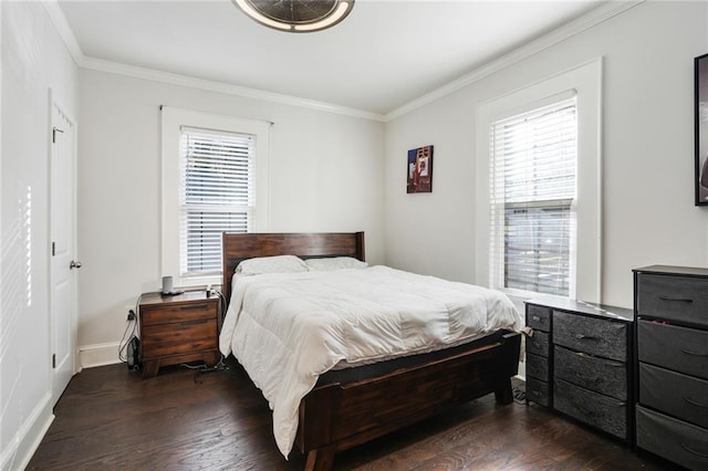 bedroom with ornamental molding and dark wood-type flooring