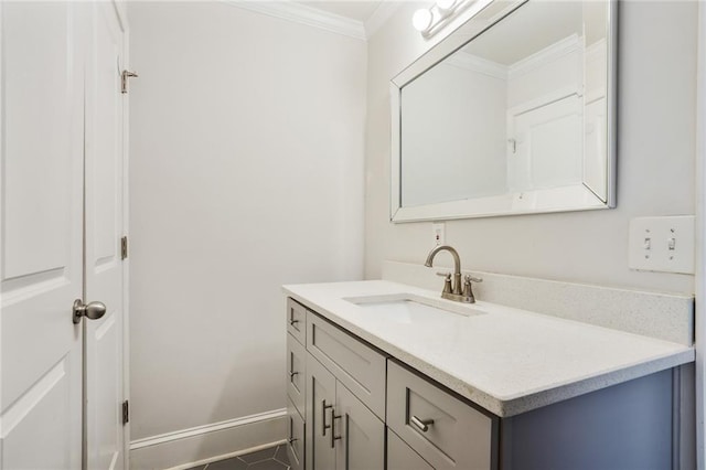 bathroom with ornamental molding and vanity