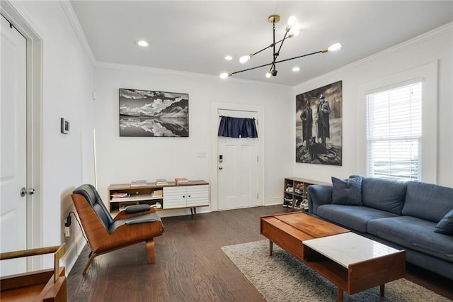 living room featuring ornamental molding, a chandelier, and dark hardwood / wood-style flooring