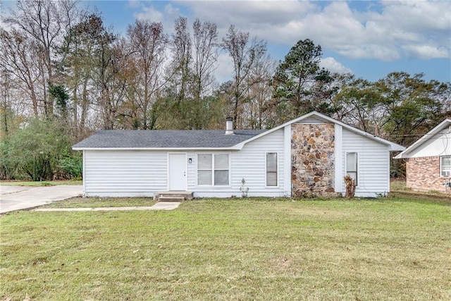 back of house with a lawn