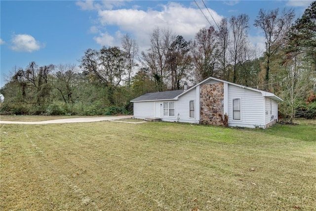 view of property exterior with a yard